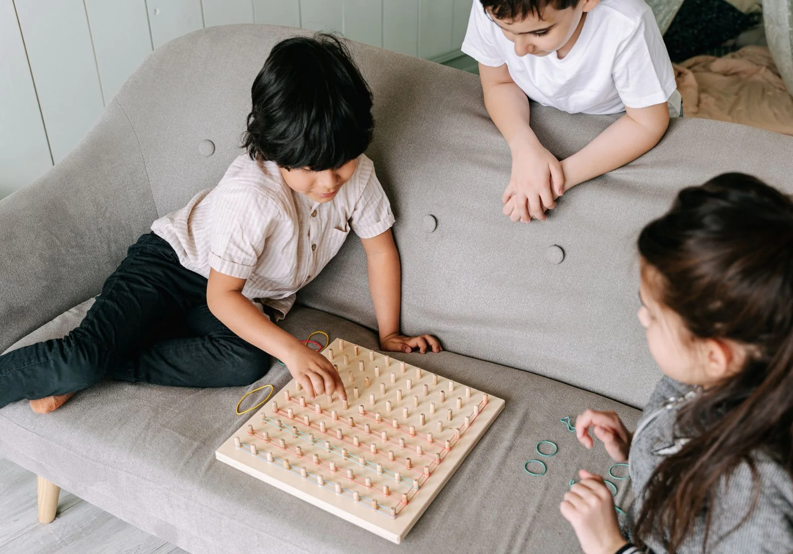 Children concentrating on a cooperative board game